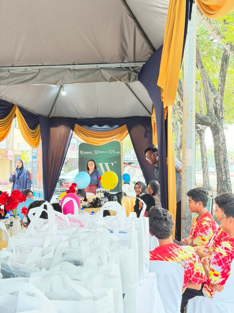 Wide view of the marquee during the speeches, with goodie bags stacked in the foreground